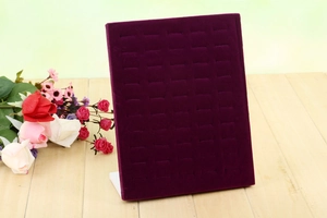 L-shaped purple velvet 50-slot ring display stand shown on wood with roses