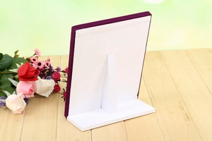 L-shaped ring display stand with 50 slots featuring purple velvet trim and stable back support