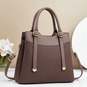 Brown faux leather handbag with pleated texture and golden hardware for daily commute