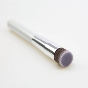 Detailed close-up of flat foundation brush with purple gradient synthetic bristles