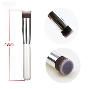 Flat head foundation brush with white handle and 13cm compact design for seamless makeup