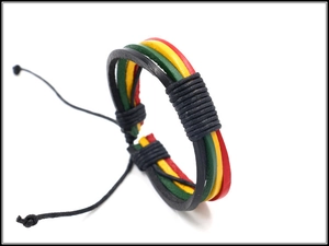 Detail of multi-strand braided leather bracelet in red, yellow, and green reggae colors