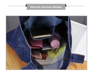 Close-up of the large interior storage space and side pockets of the denim tote bag