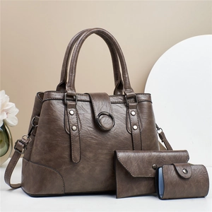 Three-piece brown textured faux leather handbag set with large tote and matching wallets