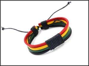 Macro detail of braided leather bracelet with Reggae red yellow green and black colors