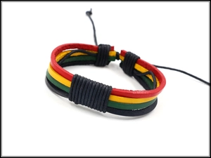 Macro detail of Jamaican reggae style multilayer braided leather bracelet with adjustable cord