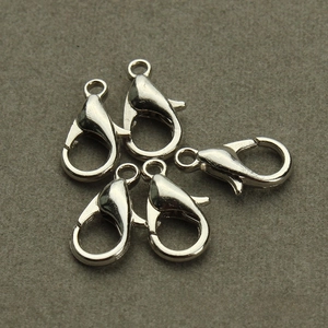 Macro shot of silver zinc alloy lobster clasps for DIY jewelry making and necklace crafts