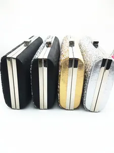 Detail view of four crystal evening clutch bags in black, gold, and silver finishes