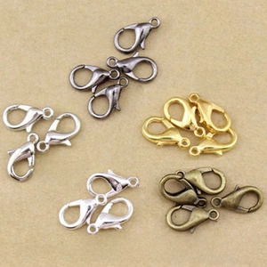Macro shot of zinc alloy lobster clasps in gold silver and bronze for jewelry making