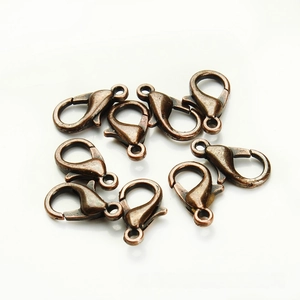 Macro detail of antique bronze zinc alloy lobster clasps for DIY jewelry making projects