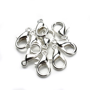 Macro shot of silver zinc alloy lobster clasps for DIY jewelry making and necklace crafts