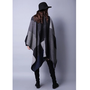 Detail of the high-quality plaid pattern and fine lockrand edge on this women's shawl cape