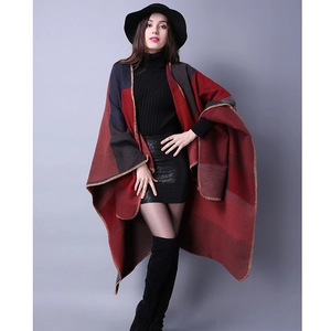 Detail of red and grey geometric pattern shawl with high-quality edge stitching finish