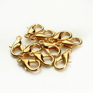 Macro shot of 10 pieces of high-gloss gold-plated lobster clasps for DIY jewelry making