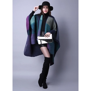 Close-up of thick knit texture and color-block stitching on this winter poncho cape