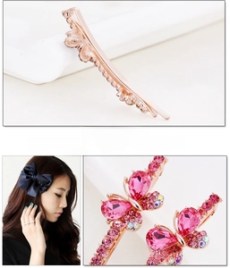 Detail of rose gold hair clip with pink crystal butterfly and sparkling rhinestones