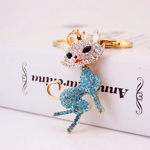 Golden cat keychain with blue rhinestones and crown, featuring a premium metal ring