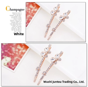 Detail view of crystal bow hair clips with rose gold base and sparkling white rhinestones