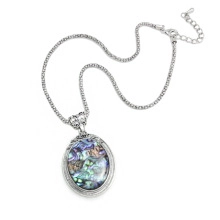 Detail of silver chain necklace featuring abalone shell oval pendant and lobster clasp