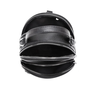 Top view of black pebbled leather round bag showing three separate zipper compartments