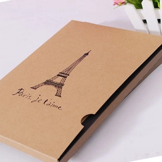Close-up of brown kraft paper box featuring Eiffel Tower and Paris je t'aime text