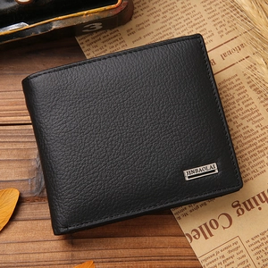 Classic black leather bi-fold wallet for men with textured finish on wood background