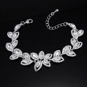 Detailed view of silver angel wing bracelet with marquise-cut cubic zirconia crystals