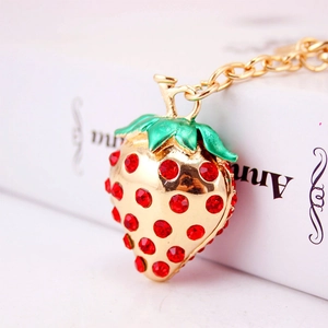 Chic gold-tone strawberry keychain with sparkling red rhinestones for car and bag decor