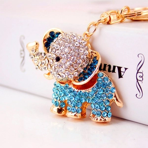 Sparkling crystal elephant keychain with blue and clear rhinestones on gold metal plating