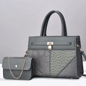 Deep grey fashion handbag set with snakeskin and ostrich textures and gold lock detail