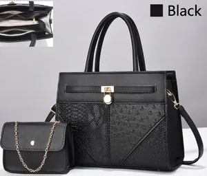 Detailed view of black faux crocodile leather tote set with chain strap bag and multi-compartment interior