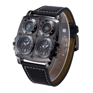 Detail of Oulm multi-zone watch showing dual dials, compass, and thermometer dials