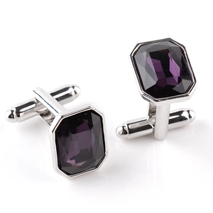 Men's silver cufflinks with purple step-cut crystals shown in a high-quality flat lay view