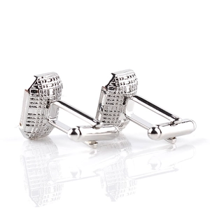 Detailed view of silver cufflinks featuring geometric grid pattern and rotating T-clasp