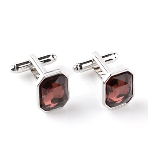 Detailed view of silver octagon cufflinks with amber glass stones for men's formal shirts