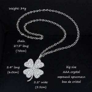 Silver clover necklace with AAA crystals pendant on long 70cm chain over dark background