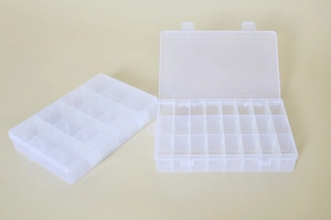 Detailed view of open and closed transparent plastic storage box with adjustable grid dividers