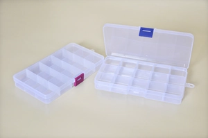 Detailed view of clear plastic organizers with multi-grid compartments and colored latches