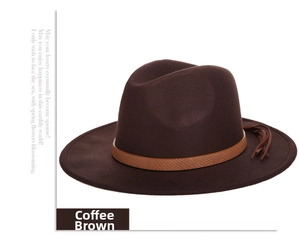 Detail of coffee brown wool fedora with a crocodile texture band and leather tassel fringe