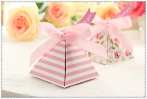 Pink striped and floral pyramid favor boxes with pink ribbon bow and thank you tag