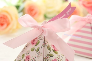 Detailed view of pink floral wedding candy box with silk ribbon and Thank You tag