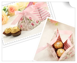 Detailed views of pink pyramid gift box with rose patterns and ribbon closure