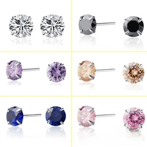 Detail view of round cut stud earrings in six colors with classic four-prong silver setting