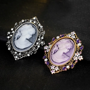 Vintage cameo queen portrait brooches in silver and gold frames with crystal accents