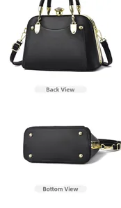 Rear and bottom view of black lychee grain handbag with gold hardware and metal feet