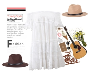 Flat lay of white off-shoulder lace top with fedora hats and boho vacation accessories
