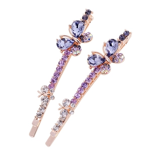 Set of two bow-shaped hair clips in rose gold alloy with purple and white crystals