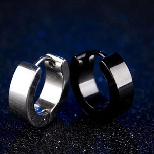 Brushed stainless steel C-shaped hoop earrings in silver and black with snap closure