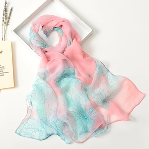 Elegant pink and blue gradient silk scarf for women draped over an artistic white frame