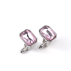 Detail of pink rectangular crystal cufflinks with polished silver metal base